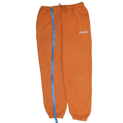 Back view of Ellesse women’s orange fleece sweatpants, size UK 10, regular fit
