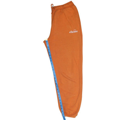 Close-up detail of Ellesse women’s orange fleece sweatpants, size UK 10, regular fit
