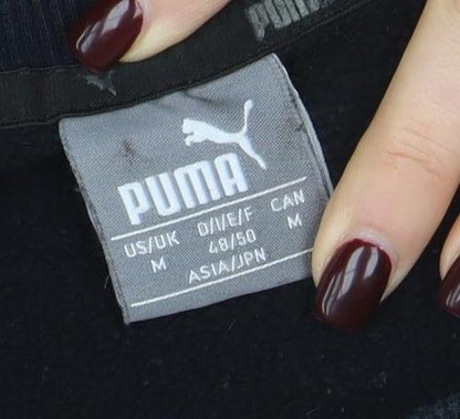 Brand and care label for Puma Men's Black Crew Neck Logo Pullover Sweatshirt, size M