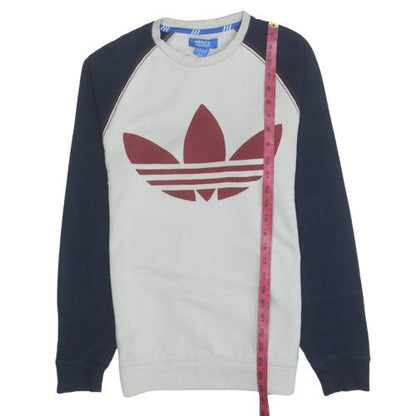 Close-up detail of Adidas men’s beige crew neck pullover sweatshirt xs classic logo