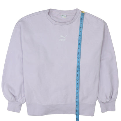 Close-up detail of Puma women’s lilac crew neck pullover sweatshirt, size L, relaxed fit