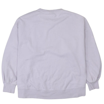 Brand and care label for Puma women’s lilac crew neck pullover sweatshirt, size L, relaxed fit