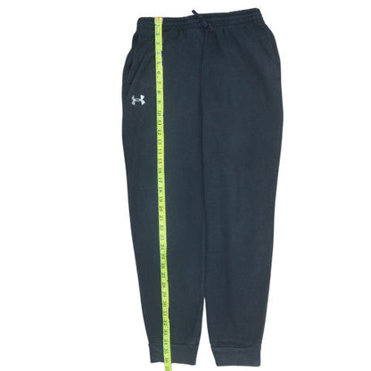 Close-up detail of Under Armour boys’ black jogger fleece sweatpants, size 158, youth xl