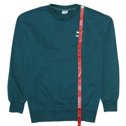 Close-up detail of Puma boys’ teal blue crew neck sweatshirt m cotton logo pullover