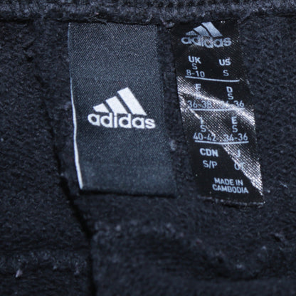Close-up detail of Adidas women’s black small jogger sweatpants with white stripes