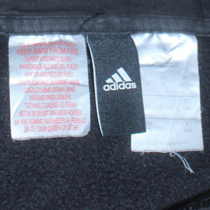 Close-up detail of Adidas boys’ black pullover hoodie 13-14 years classic 3-stripes design