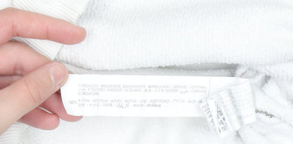 Brand and care label for Disney boys’ white mickey mouse pullover sweatshirt 9 years 90th anniversary