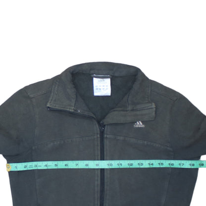 Close-up detail of Adidas women’s black track jacket, size UK 12, full zip cotton blend