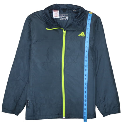 Close-up detail of Adidas boys’ blue 11-12 years lightweight puffer jacket with neon zip