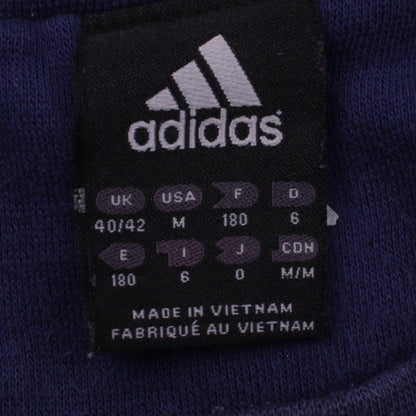 Close-up detail of Adidas men’s blue crew neck pullover sweatshirt m sports logo