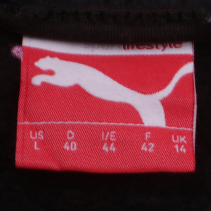 Close-up detail of Puma women’s black track jacket, size UK 14, full zip cotton blend