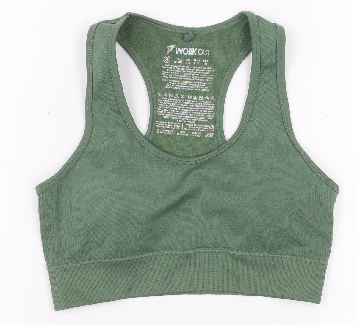 Prewornwholesale green racerback sports bra with medium support and seamless construction for activewear.