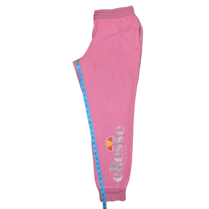 Brand and care label for Ellesse women’s pink jogger sweatpants, size UK 14, cotton blend