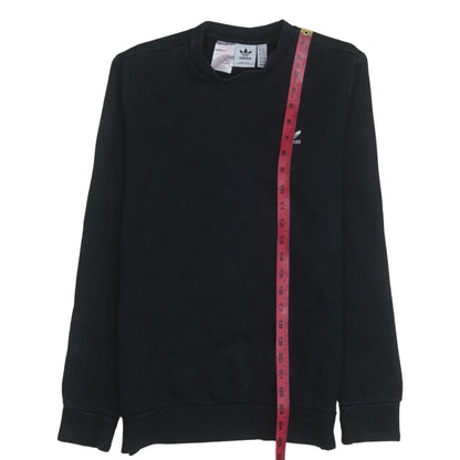 Close-up detail of Adidas boys’ black crew neck pullover sweatshirt 13-14 years