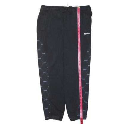 Close-up detail of Adidas women’s black jogger sweatpants l elastic waist drawstring pockets