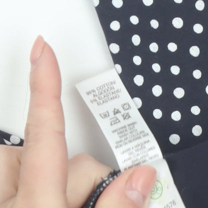 Brand and care label for St. Bernard for Dunnes girls’ black polka dot biker shorts age 5