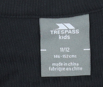 Brand and care label for Trespass boys’ black 11-12 years 1/4 zip fleece sweatshirt