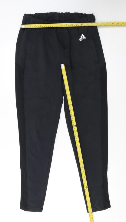 Back view of Adidas women’s black jogger trousers, size S, regular fit
