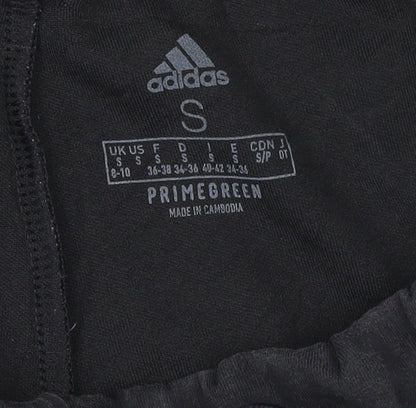 Brand and care label for Adidas women’s black jogger trousers, size S, regular fit