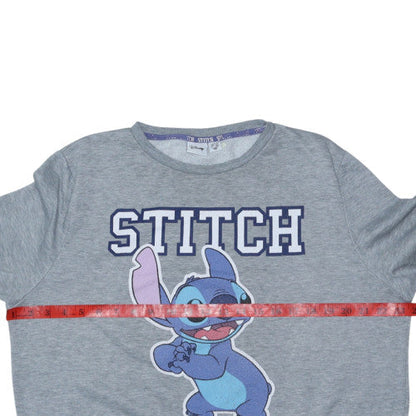 Brand and care label for Disney women’s grey stitch sweatshirt l 14/16 crew neck pullover