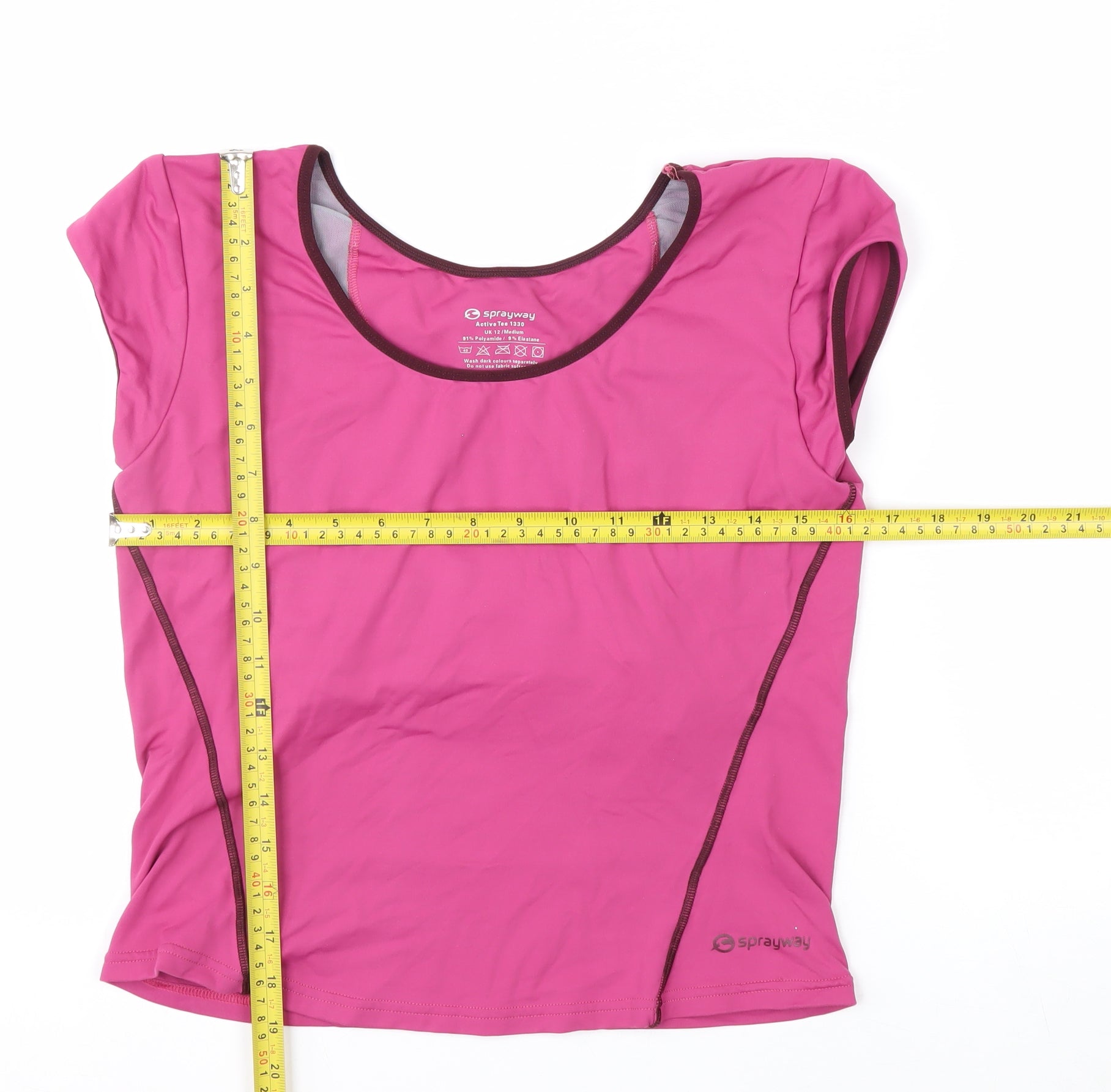 Prewornwholesale green racerback sports bra with medium support and seamless construction for activewear.