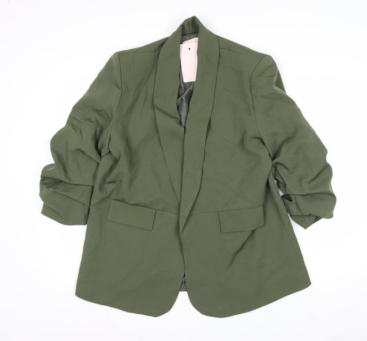 Prewornwholesale green racerback sports bra with medium support and seamless construction for activewear.