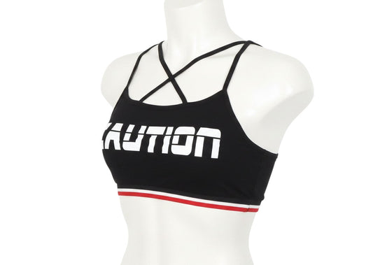 Prewornwholesale black cropped sports bra with white CAUTION graphic and red and white striped elastic hem