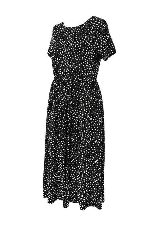 Prewornwholesale Wednesday's Girl black midi dress with white floral print, short sleeves, and A-line silhouette.