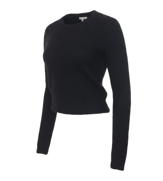 Prewornwholesale black fuzzy knit cropped cardigan with long sleeves and a round neckline in a soft polyamide fabric.