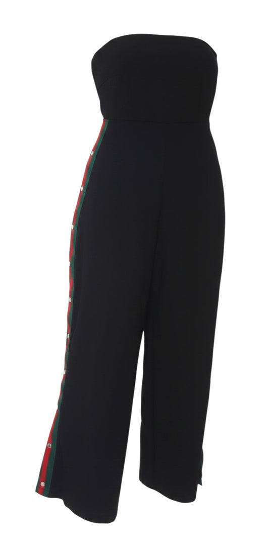 Prewornwholesale black strapless wide-leg jumpsuit featuring a red and green side stripe with silver press-buttons.