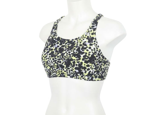 Prewornwholesale Next women's racerback sports bra in a black, white, and yellow animal print nylon blend fabric.