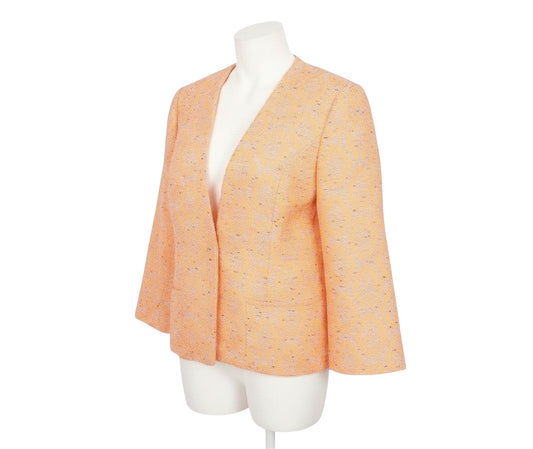 Prewornwholesale Marks and Spencer orange geometric open front blazer on a mannequin