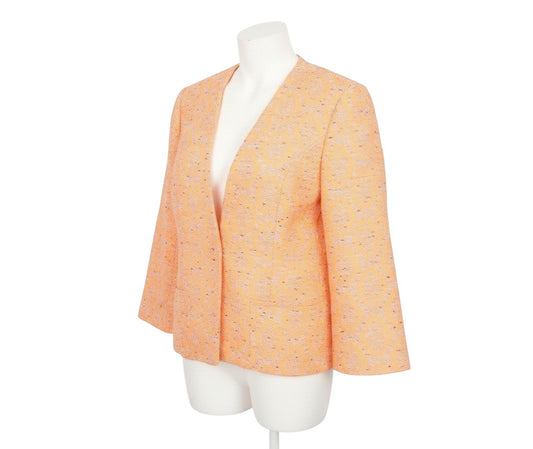 Prewornwholesale Marks and Spencer orange geometric open front blazer with textured woven fabric on a mannequin