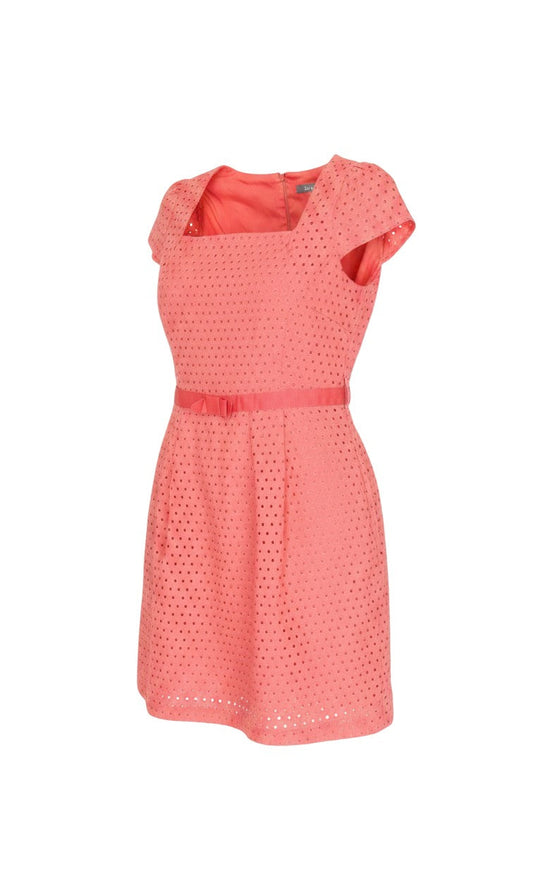 Prewornwholesale pink cotton eyelet shift dress with square neckline, cap sleeves, and a matching belted waist.