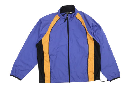 Prewornwholesale ProSpirit women's blue windbreaker jacket with orange and black colourblock panels and zip closure.