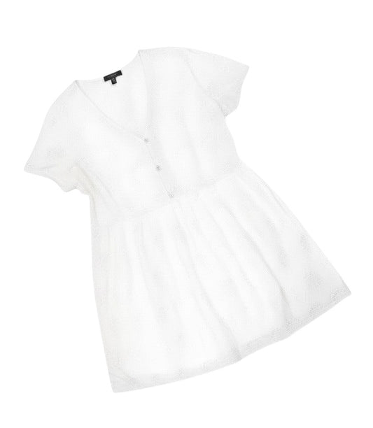 Prewornwholesale white cotton A-line dress with V-neck, short sleeves, and textured broderie anglaise-style fabric.