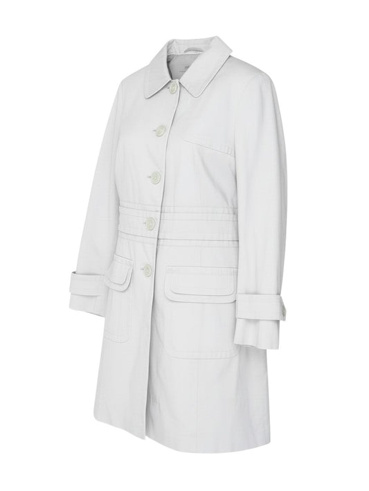 Prewornwholesale white cotton-rich long trench coat with button front, pleated waist detail, and flap pockets.